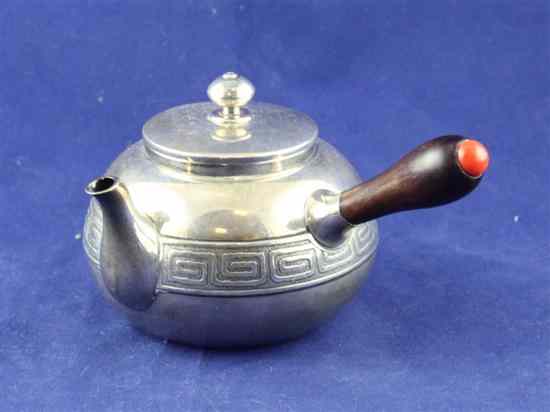 Appraisal: A Chinese silver teapot of globular form with engraved Greek