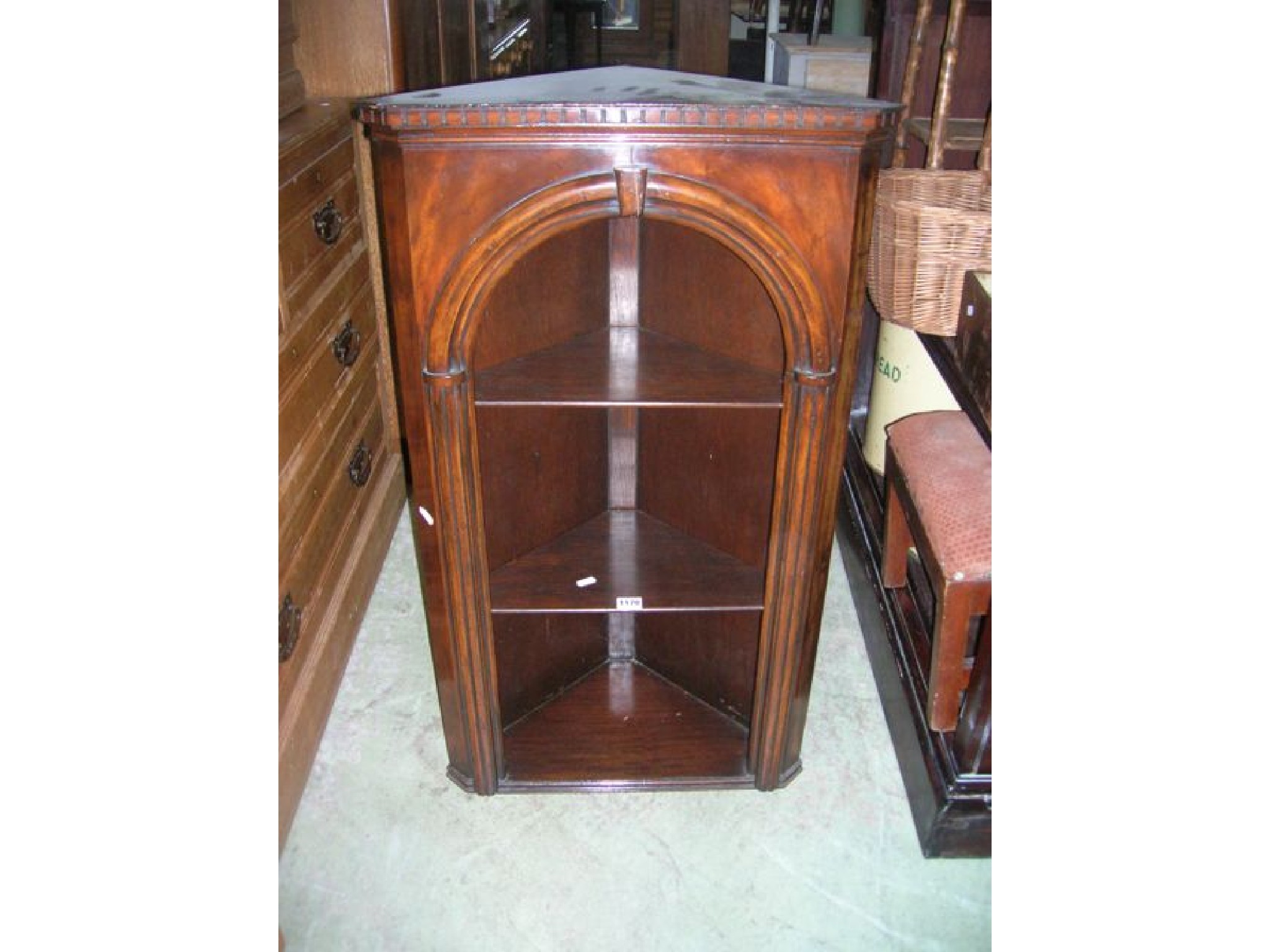 Appraisal: A small reproduction walnut hanging corner cupboard in the Georgian