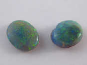 Appraisal: Two loose polished opals total weight approx gms carats larger