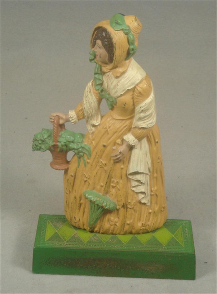 Appraisal: Cast iron doorstop large elegant hollow back woman with bonnet