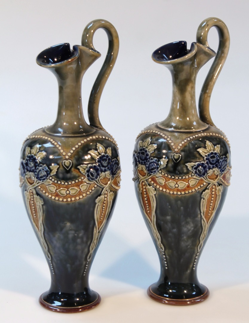 Appraisal: A pair of early thC Royal Doulton stoneware ewers each