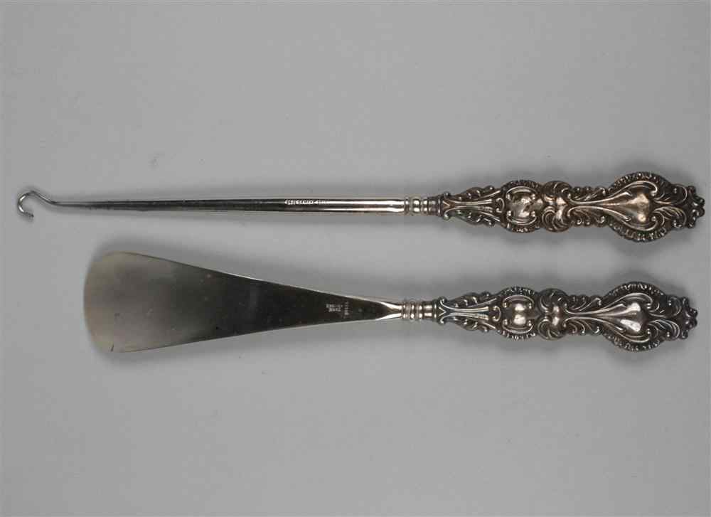 Appraisal: TWO LADY'S BIRMINGHAM SILVER MOUNTED STEEL BOOT UTENSILS the handles