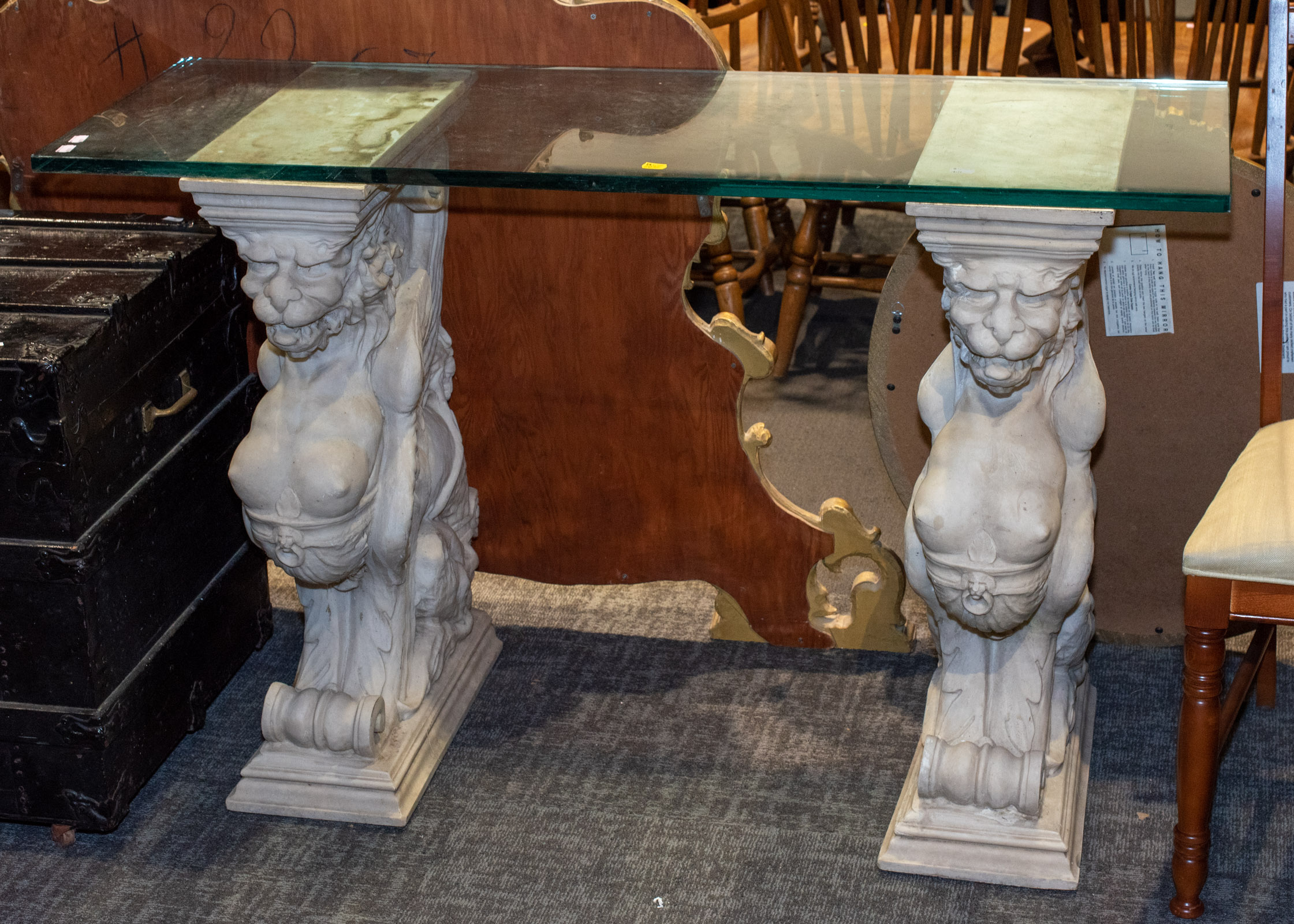 Appraisal: RENAISSANCE STYLE GLASS TOP CONSOLE TABLE With cast resin sphinx