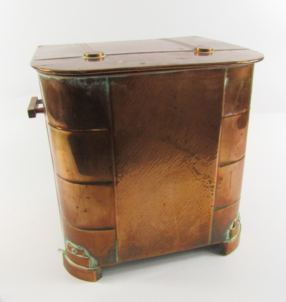 Appraisal: An Art Deco copper coal box with twin carrying handles