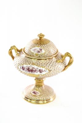 Appraisal: A Coalport urn and cover decorated in gilt and puce