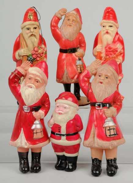 Appraisal: Lot of Celluloid Standing Santas Description Japanese One has a