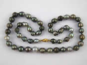 Appraisal: A grey Tahitian cultured pearl necklace with a yellow metal