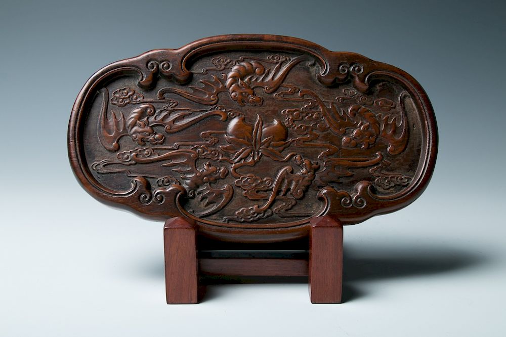 Appraisal: CARVED HARDWOOD QUATRELOBED PLATE QING With shallow rounded sides supported