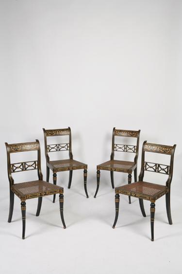 Appraisal: A SET OF FOUR REGENCY GILT AND EBONISED SALON CHAIRS