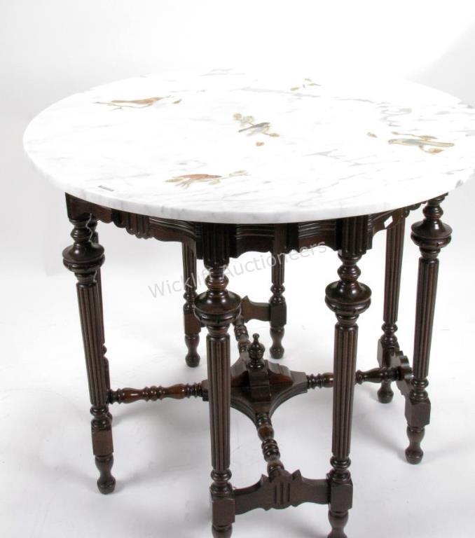 Appraisal: An antique round foyer table with reeded accents on mahogany