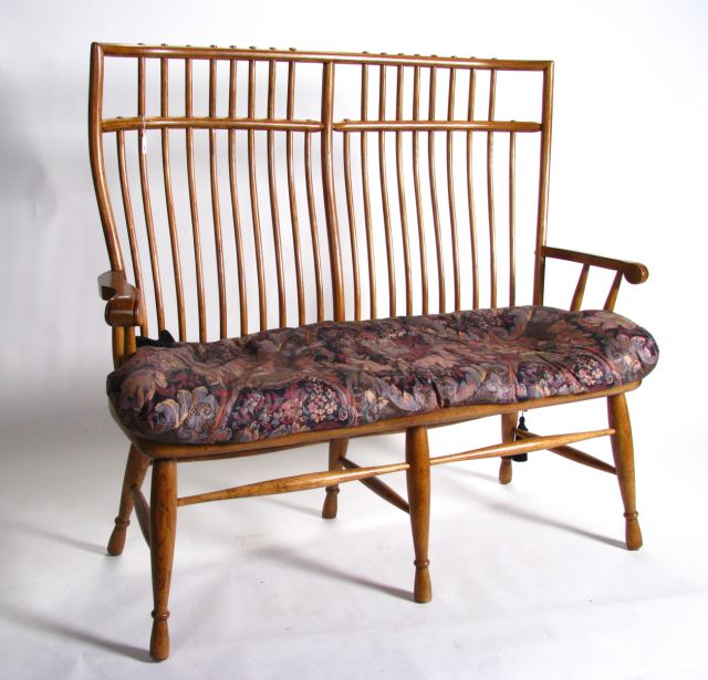 Appraisal: Early American style spindle back settee distressed light fruitwood finish