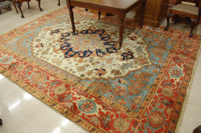 Appraisal: HAND KNOTTED ORIENTAL CARPET Persian Serapi design stylized floral and