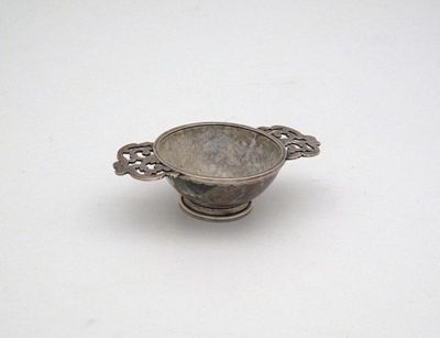 Appraisal: A silver mounted hard stone quaich unmarked circular form pierced