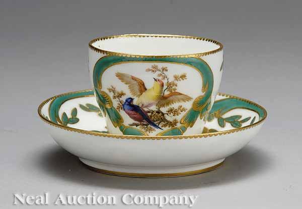 Appraisal: A S vres Polychrome and Gilt Porcelain Cup and Saucer