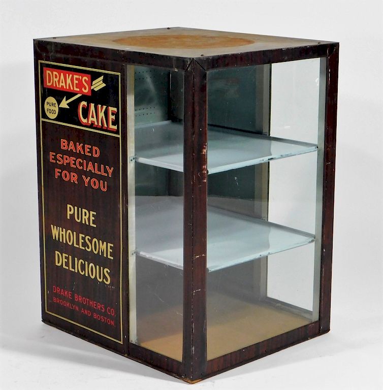 Appraisal: Drake's Cake Country Store Advertising Cabinet United States - Grain