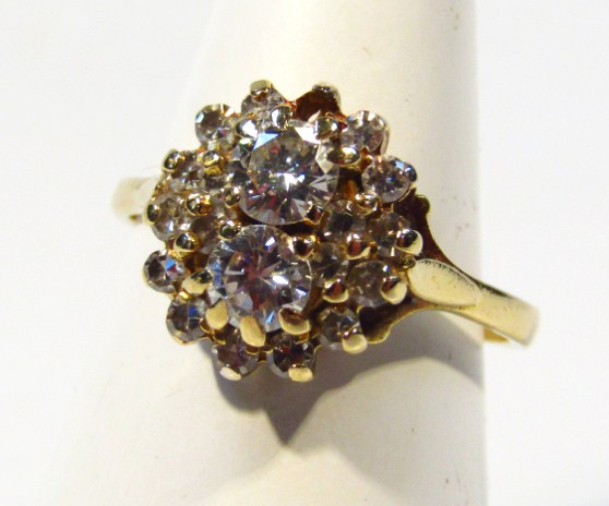 Appraisal: A ladies claw set diamond cluster ring on a part