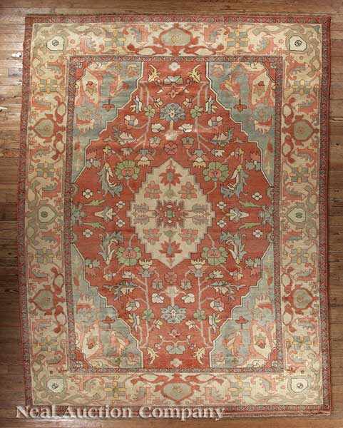 Appraisal: A Persian Serapi Carpet cream rose and blue ground with