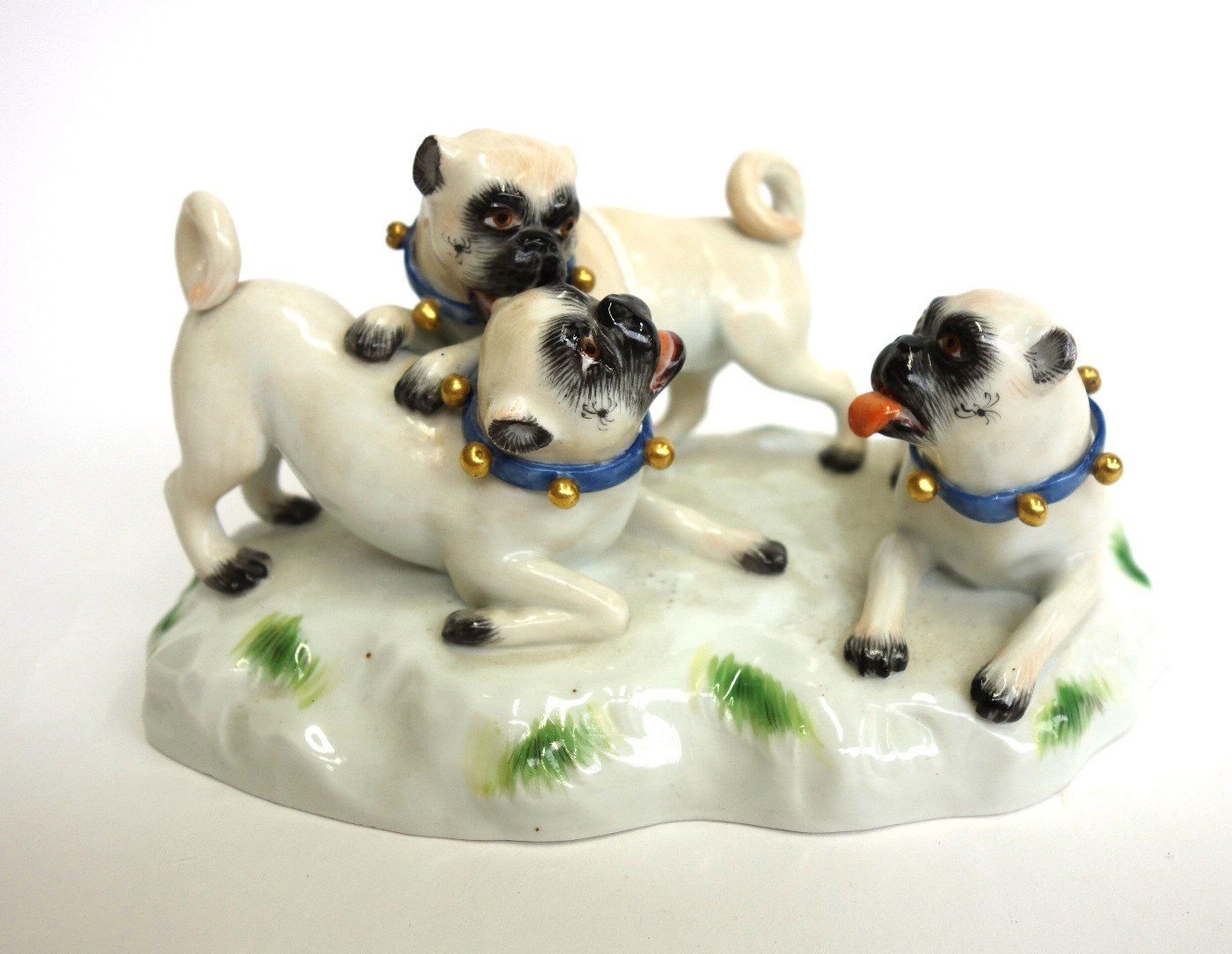 Appraisal: A Meissen porcelain pug group th century modelled with three