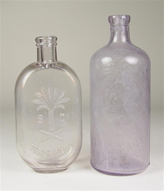 Appraisal: Two South Carolina Dispensary Bottles One cylindrical bottle marked SC