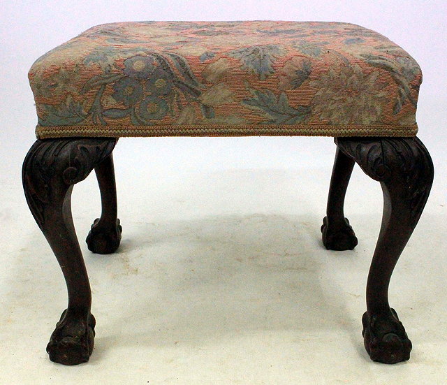 Appraisal: A TH CENTURY MAHOGANY FRAMED OVERSTUFFED UPHOLSTERED STOOL with carved