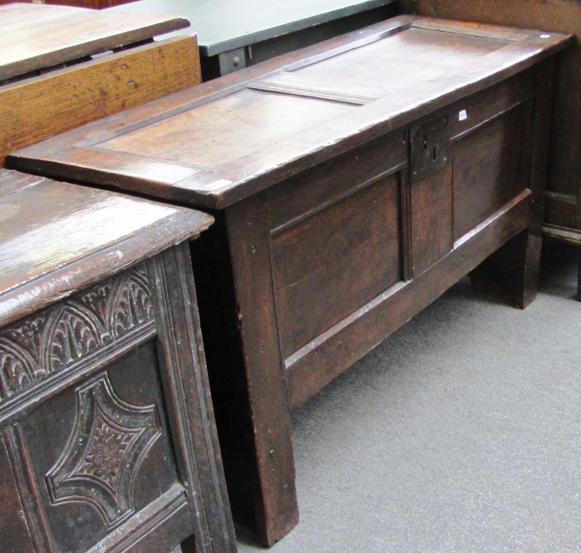 Appraisal: A th century oak coffer with double panelled lid and