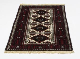 Appraisal: Hand knotted Baluch wool rug ' x ' Hand-knotted Baluch