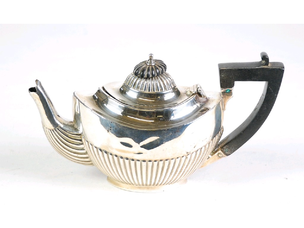 Appraisal: BACHELORS SILVER TEAPOT oval part fluted form with black angular