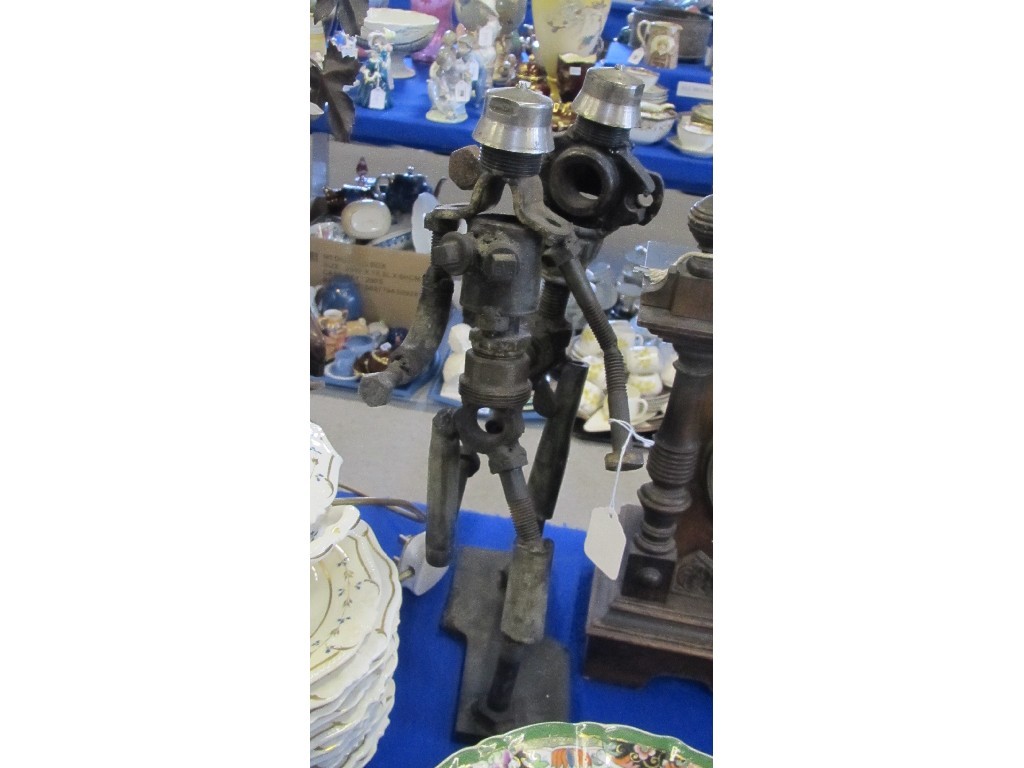 Appraisal: Sculpture of two figures made from car parts