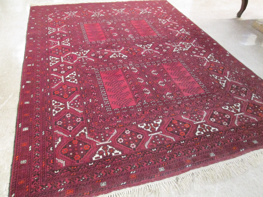 Appraisal: HAND KNOTTED ORIENTAL CARPET Afghani Turkoman Kachli Bokhara pattern on