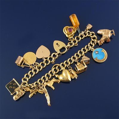 Appraisal: A gold bracelet the curb link chain with heart padlock