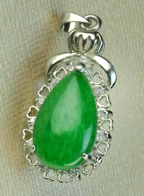 Appraisal: Chinese Jade PendantA silver metal mount housing a tear drop