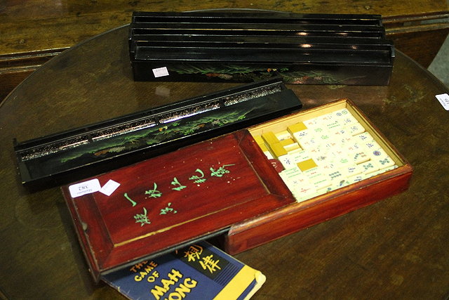 Appraisal: A CHINESE MAHJONG SET with ivory counters in a sliding