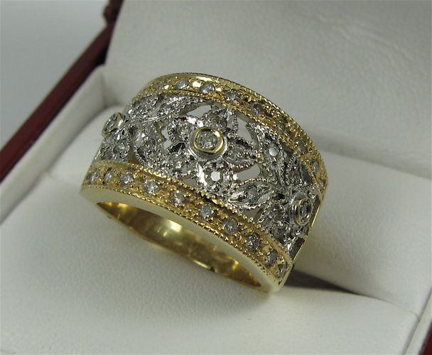 Appraisal: DIAMOND AND K YELLOW AND WHITE GOLD RING the top