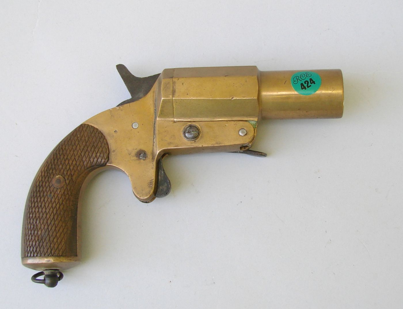 Appraisal: BRASS FLARE GUN th CenturyWith wooden grips