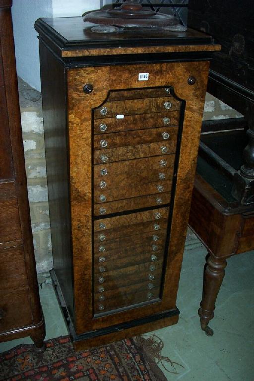 Appraisal: A specimen cabinet fitted with drawers behind a glazed door