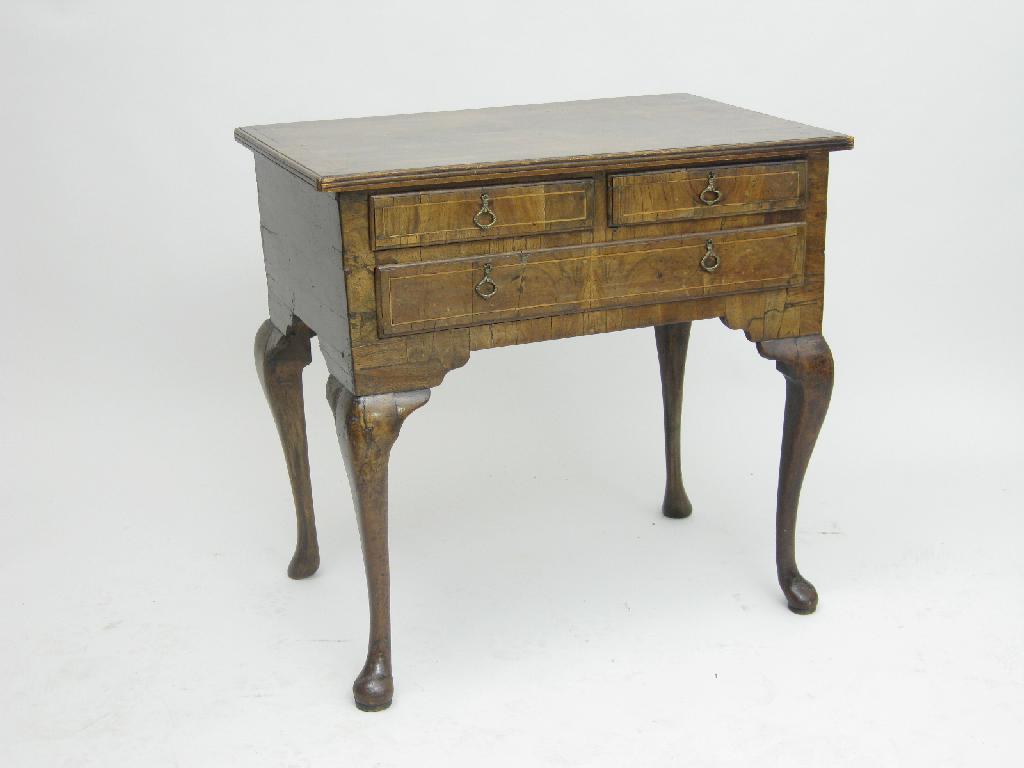 Appraisal: An early th Century walnut Lowboy with satinwood stringing fitted