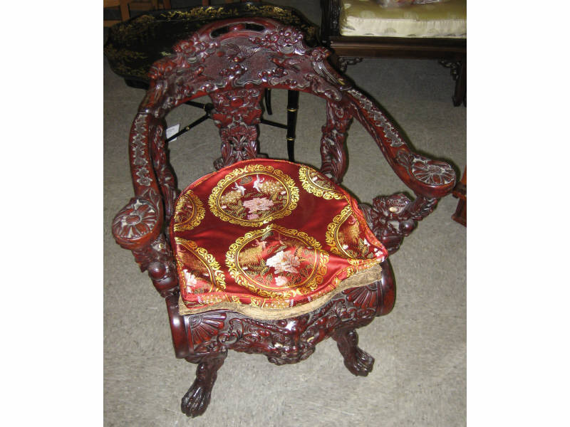 Appraisal: CHINESE DRAGON CARVED RED WOOD CHAIR Elaborately carved allover with