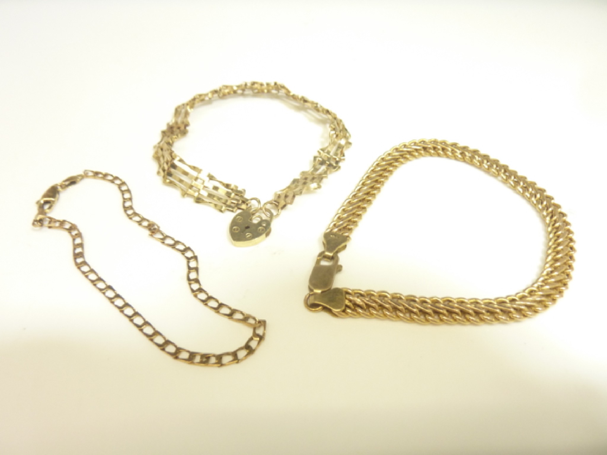 Appraisal: A ct gold gate-link bracelet with heart-shaped padlock clasp g