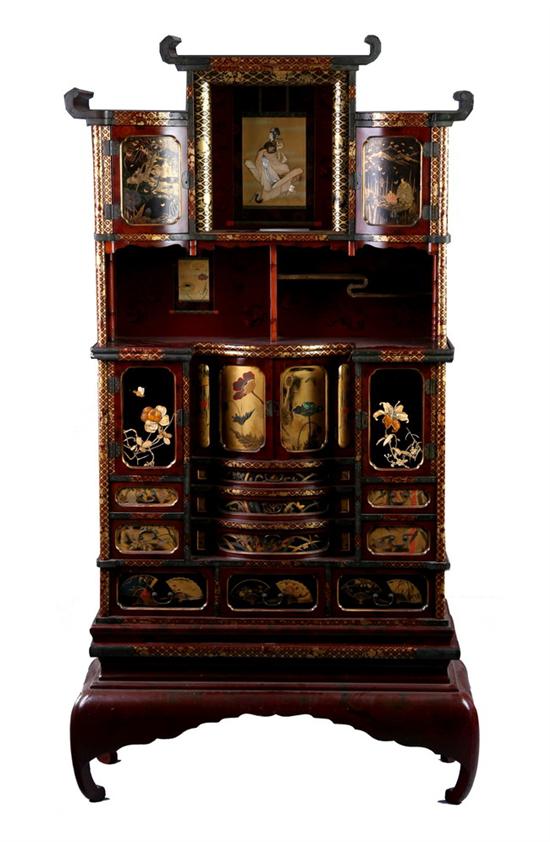 Appraisal: JAPANESE CURIO CABINET In three sections lacquered and inlaid with