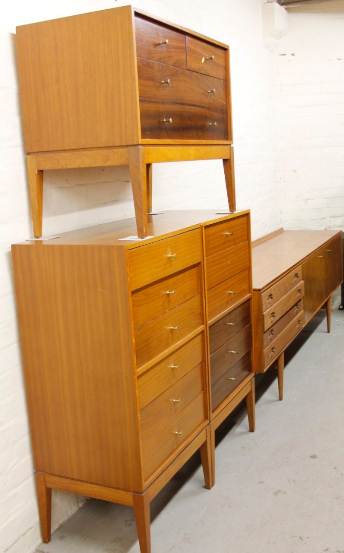 Appraisal: A 's Uniflex suite comprising side cabinet and two six