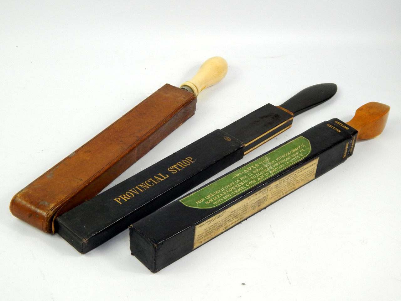 Appraisal: Three razor strops late thC B S Cowan's Canton strap