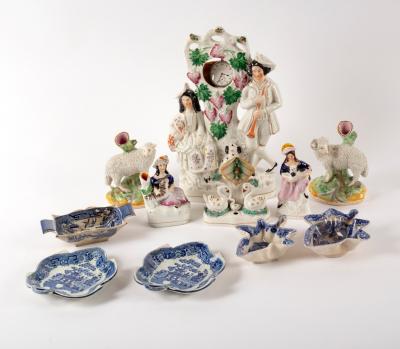 Appraisal: A group of Staffordshire figures including a watch stand and