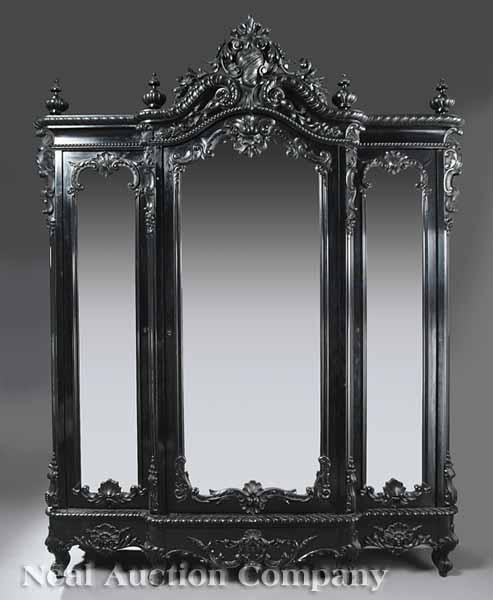 Appraisal: A Fine Continental Rococo Revival Carved and Ebonized Armoire mid-