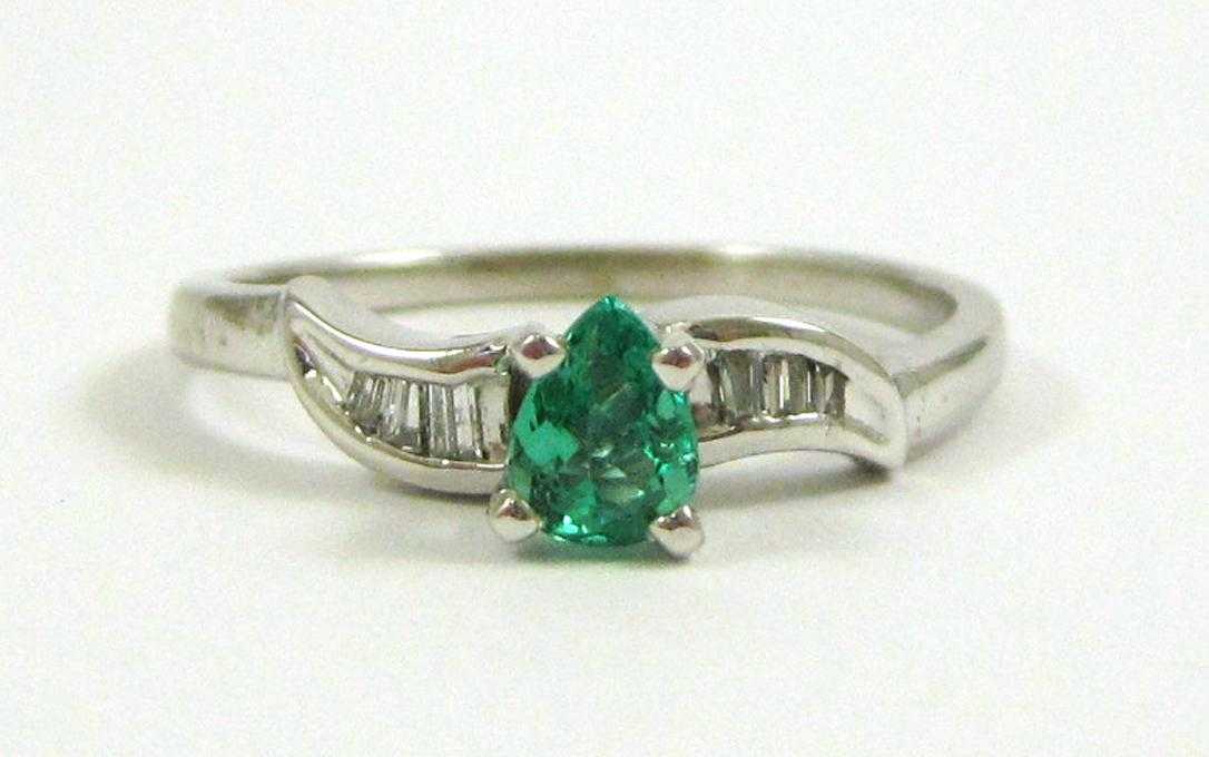 Appraisal: EMERALD DIAMOND AND FOURTEEN KARAT GOLD RING The white gold