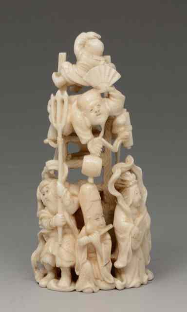 Appraisal: A JAPANESE CARVED IVORY OKIMONO the Seven Gods of Good