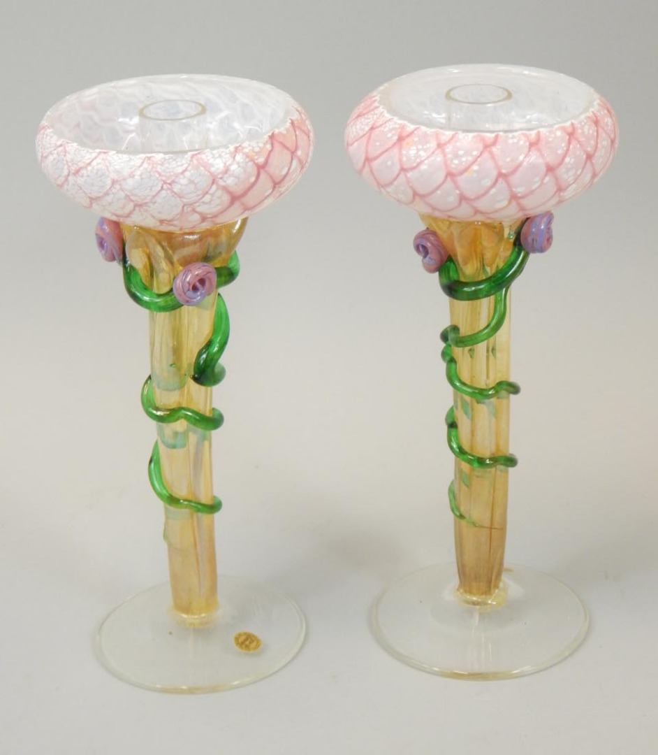 Appraisal: A pair of Australian Heaney glass candlesticks each with a