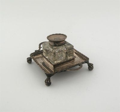 Appraisal: A late Victorian inkwell on a square base with moulded