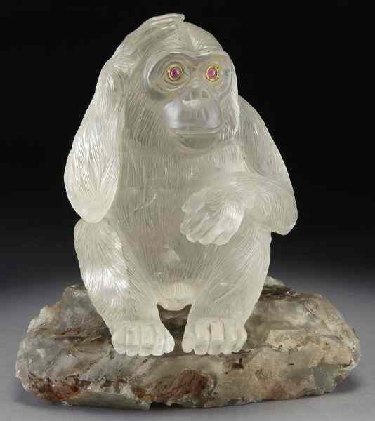 Appraisal: Faberge style carved rock crystal monkeywith ruby eyes the monkey