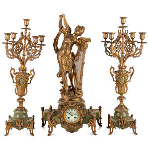 Appraisal: A French Metal and Onyx Clock Garniture with Figure after