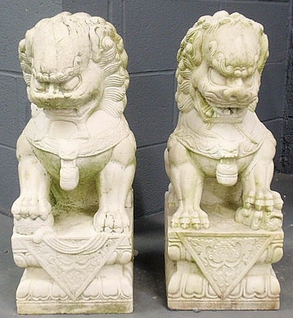 Appraisal: Pair of carved limestone Foo dogs circa h x w